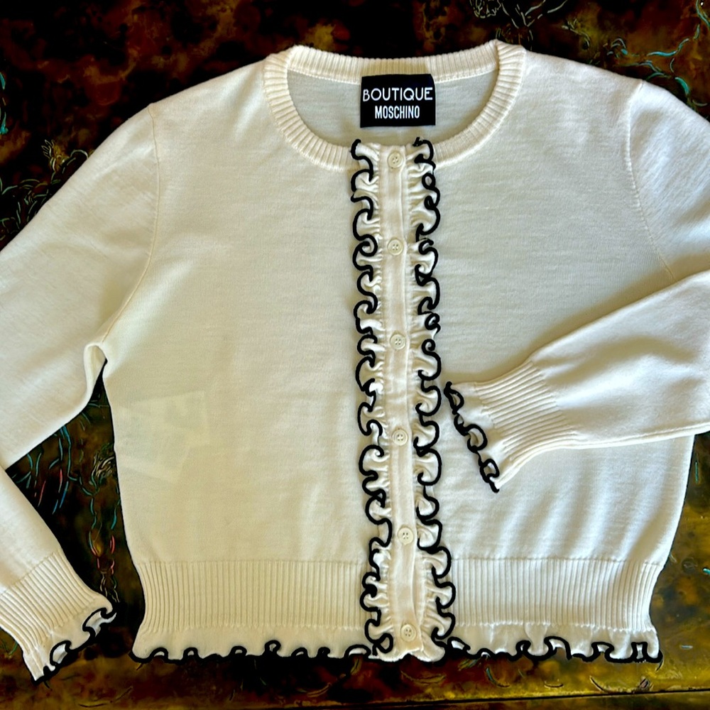 Moschino Boutique white wool cardigan with black frilly edge